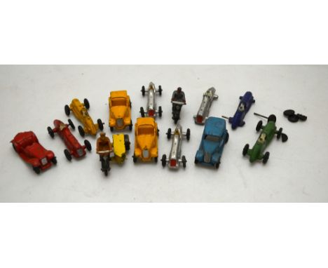 Seven vintage Dinky miniature racing cars, - some lacking wheels, to/w a saloon car, three open tourers, an AA motorcycle wit