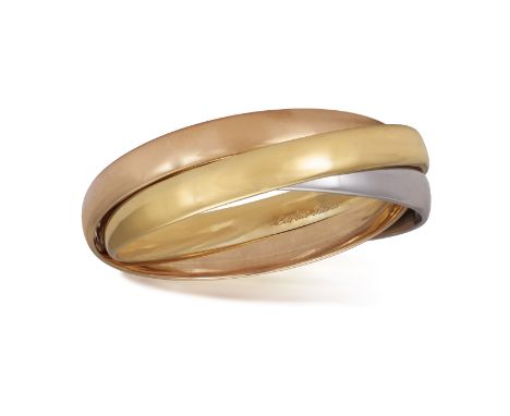 A GOLD 'TRINITY' BANGLE, BY CARTIER  Composed of three interlocking polished 18K tri-coloured gold bangles, signed Cartier Pa