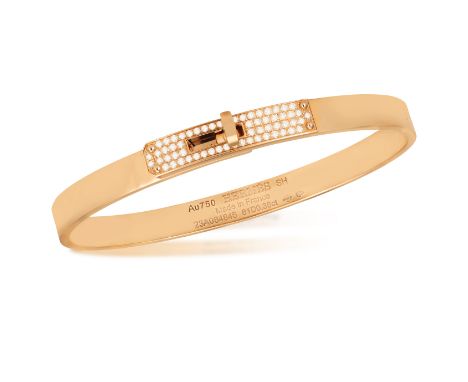 AN 18K GOLD AND DIAMOND 'KELLY BRACELET' BY HERMÈS  The polished oval gold bangle with 'Kelly' turn-clasp pavé-set with brill