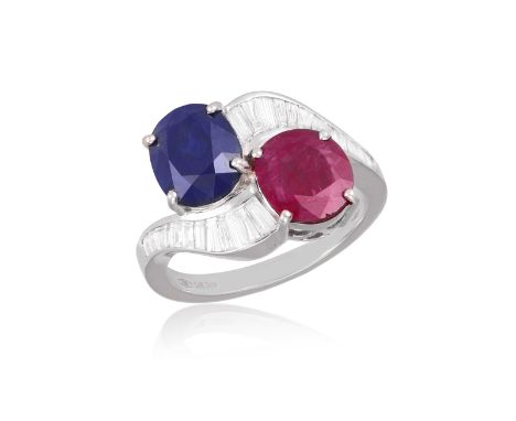 A RUBY, SAPPHIRE AND DIAMOND DRESS RING  Of crossover design, set with an oval-shaped sapphire and ruby, to tapered baguette-