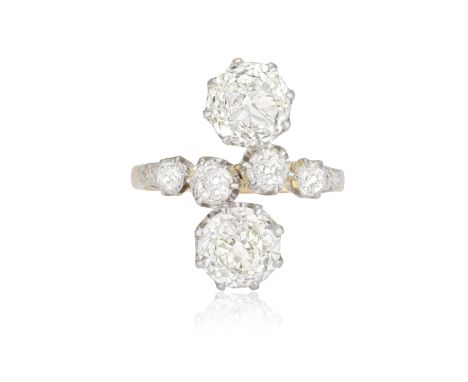 AN EARLY 20TH CENTURY 'TOI ET MOI' DIAMOND DRESS RING  Composed of two old-cut diamonds weighing respectively approximately 1