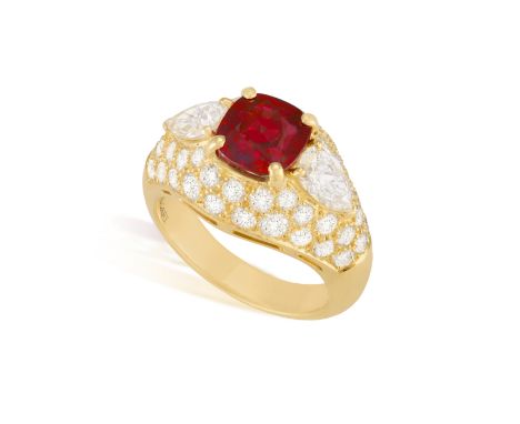 A VERY FINE RUBY AND DIAMOND RING, BY BULGARI The cushion-shaped ruby weighing 2.92cts within a four-claw setting, between tw