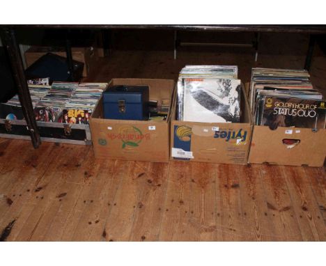 Vintage Bermuda record player and quantity of LP and single records.