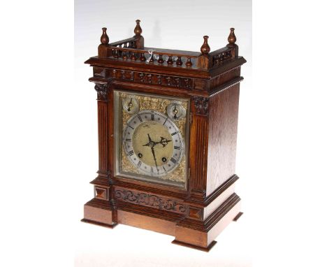 Victorian oak mantel clock with brass and silver dial, 42cm by 28cm.