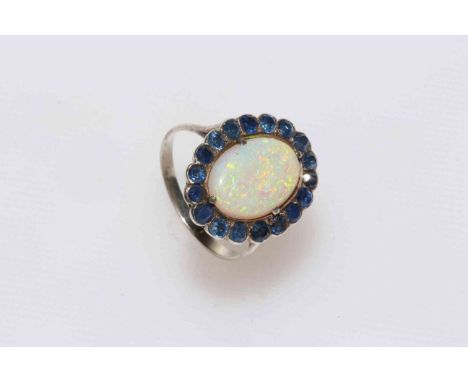 Opal and sapphire bordered ring.