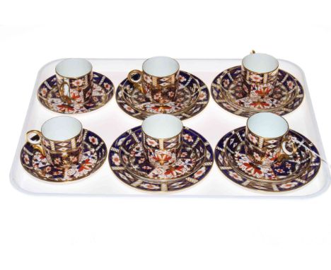 Set of six Royal Crown Derby coffee cups and saucers with four plates.