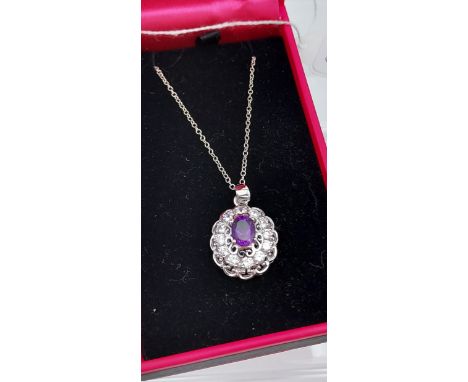 A silver &amp; CZ pendant necklace with central amethyst panel 