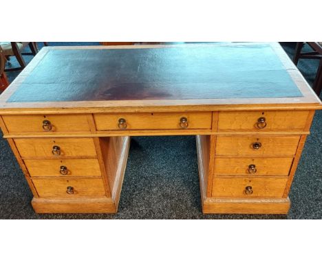 A 19th century light oak and red leather top, knee hole writing desk. [76x144x68cm] 
