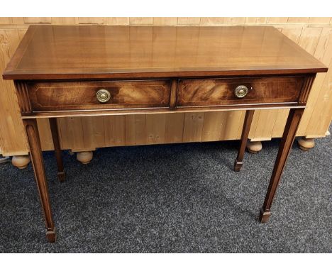 A Reproduction antique style mahogany console table fitted with two storage drawers. [84x167x46cm] 