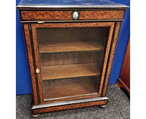 A 19TH CENTURY French style ebonised and burr walnut display cabinet. Finished with brass trims and enamel portrait plaque. [