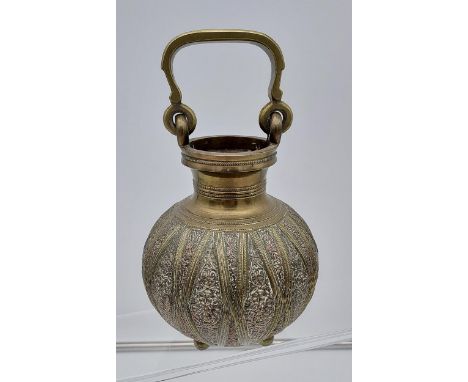 An Antique Middle Eastern brass &amp; copper swing handle urn vase. 