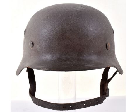 Waffen-SS Single Decal Steel Combat Helmet, with decal to the side, leather liner and leather chinstrap. We believe this to b