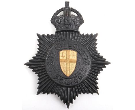 City of London Police Kings crown helmet plate, black star, with gilt coat of arms centre, complete with three lug fittings 