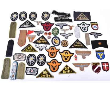 WW2 German Badges and Insignia: Mixed lot of mainly cloth badges breast eagles, cap badges, cuff band, police arm eagles and 