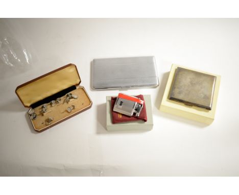 A George VI silver cigarette case by William Neale &amp; Son Ltd, Birmingham, 1937, with engine turned decoration and gilt in