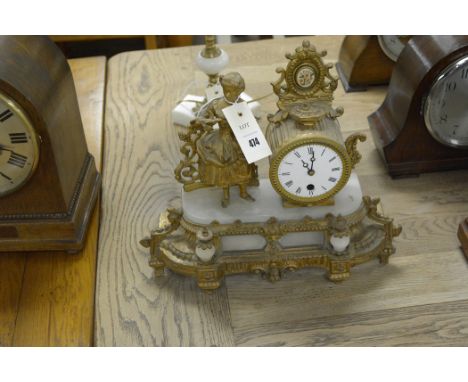 A giltmetal mantel clock, fitted later battery movement.