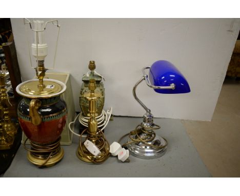 Four table lamps, to include: a blue-shade banker's lamp.