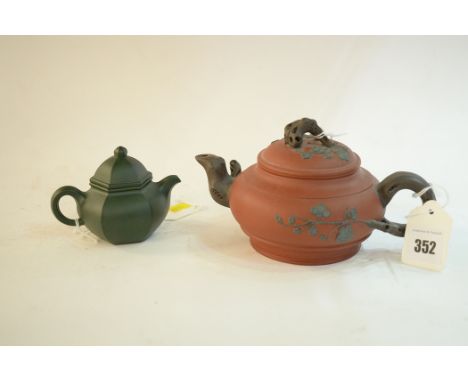 A Chinese Yi Xing red stoneware teapot, of compressed globular form, sprigged with prunus blossom, impressed seal mark, 10cms