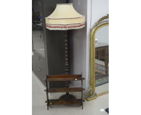 A standard lamp; and an open shelf unit.