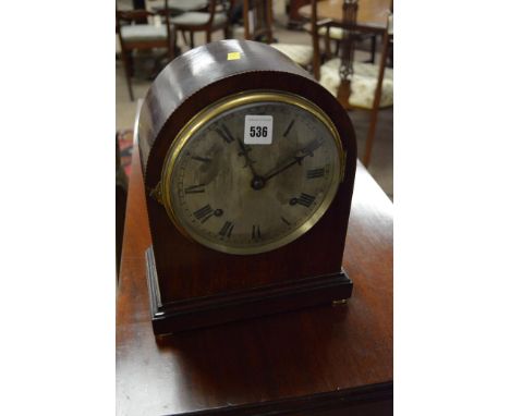 An Edwardian inlaid mahogany cased mantel clock, with silver rim and dial fitted movement striking on a gong, by William Gilb