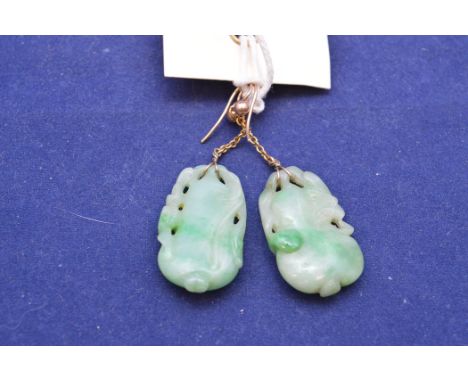 A pair of 19th Century Chinese carved jade earrings, of gourd form, hanging from chains on crook pattern mounts.