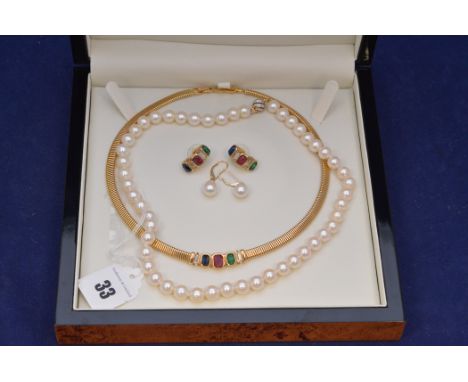 A cultured pearl necklace and pair of earrings, with yellow metal mounts stamped '585'; together with a costume necklace and 
