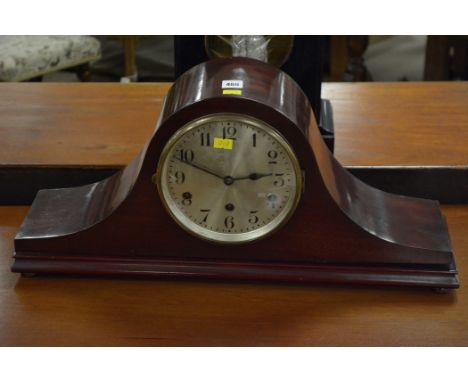 A mahogany cased mantel clock, with chiming mechanism.