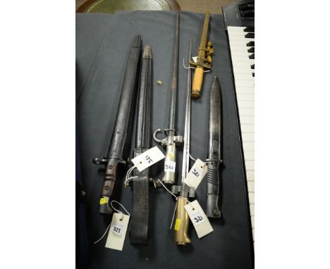 Six knives and bayonets, to include: two US M1917; French M1886; and a reproduction German officer's dagger.