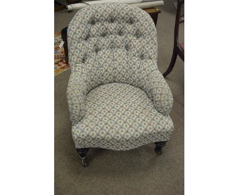 An early 20th Century button back nursing chair.