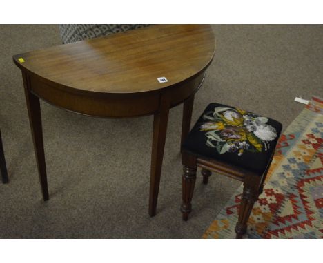 An early 19th Century mahogany stool, with reeded legs and tapestry seat; together with a 20th Century mahogany console table