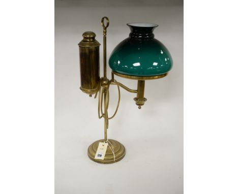 A student brass lamp with green glass shade.