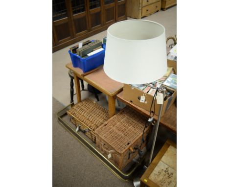 A wicker picnic basket; a Fortnum &amp; Mason hamper; together with a brass fire fender and a modern metal standard lamp.
