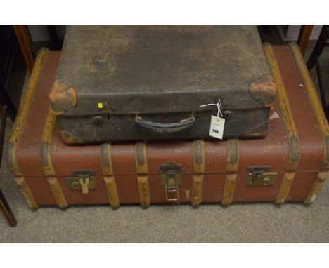 A leather cloth covered travel trunk; and a leather suitcase.