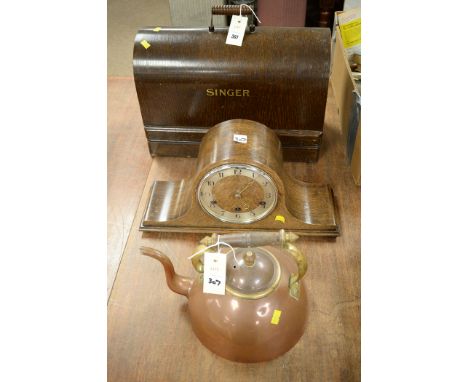 A Singer sewing machine, an oak cased mantel clock; and a copper and brass kettle.