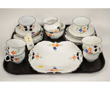 A teaset by Melba, numbered 3697, comprising; six teacups and saucers, six side plates, a sandwich plate, cream jug and sugar