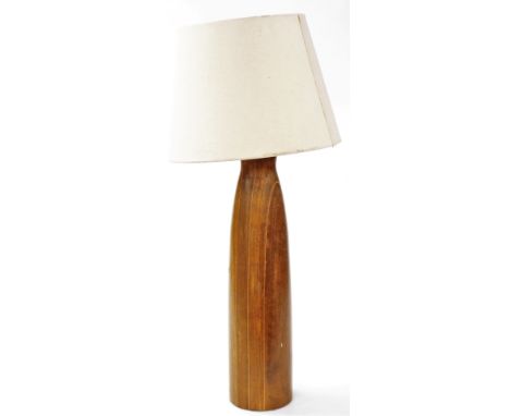 A late 20thC wooden table lamp, of tapering form, with a cream shade, approx 71cm high. (AF) 