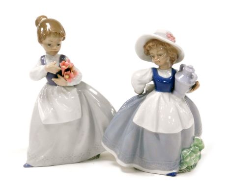 Two Nao porcelain figures, modelled as a young girl carrying a two handled vase, 18cm high, and a young girl holding flowers,