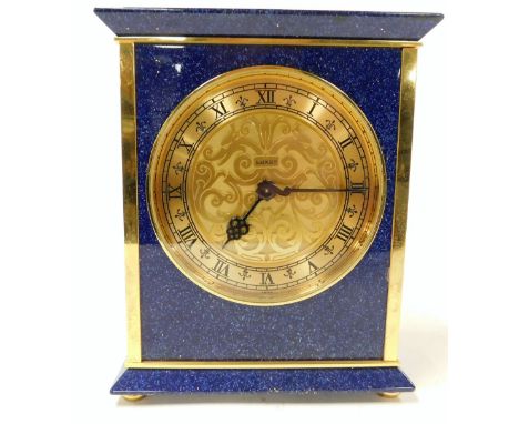 A Luxor simulated lapis lazuli and brass mantel clock, circular dial with chapter ring bearing Roman numerals, clockwork move