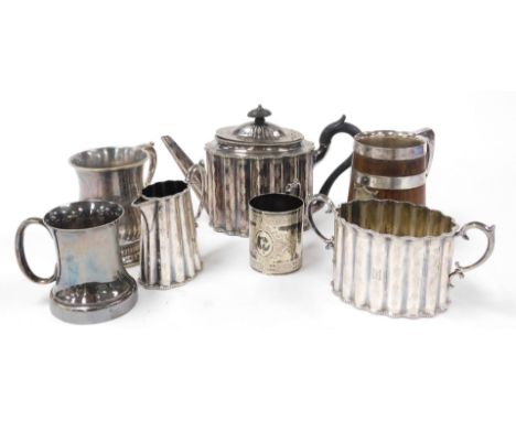 An Elkington &amp; Co silver plated three piece tea service, comprising teapot, milk jug and two handled sugar bowl, together