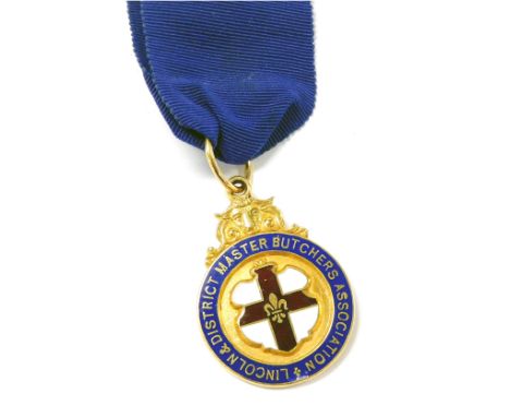 A 9ct gold and enamel jewel, for the Lincoln and District Master Butchers Association, with central reserve shield, reverse e