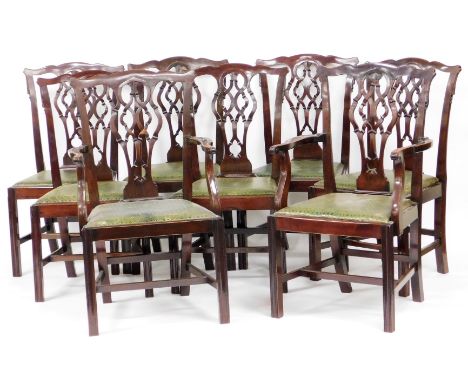 A set of eight Chippendale style mahogany dining chairs, each with a pierced Gothic shaped splat, a tooled green leather drop