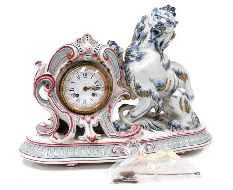 A late 19thC Sarreguemines faience cased mantel clock, circular enamel dial bearing Roman and Arabic numerals, eight day move