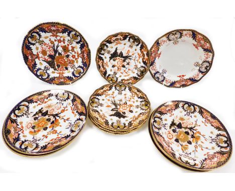 Twelve Royal Crown Derby porcelain Imari dinner and dessert plates, with gilt rims, printed marks.