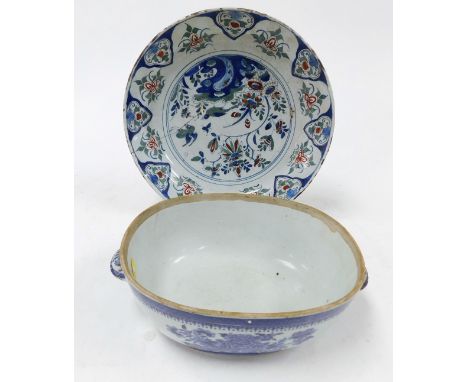 An 18thC English polychrome Delftware dish, painted centrally with birds and flowers, within a repeating floral borders, 32.5