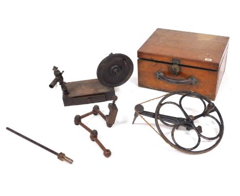 A Georgian wooden lace bobbin winder, raised on a rectangular base, with frieze drawer containing lace accoutrements, lace ma