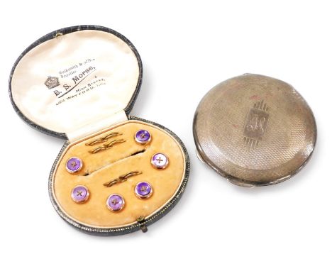 A set of six purple mother of pearl shirt buttons, in rose metal circular mounts, with fastenings, by B S Morse, Watford, cas