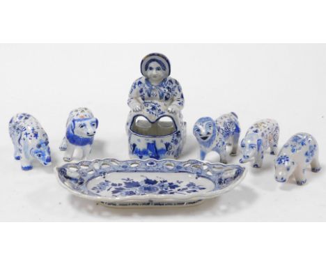 A group of 19thC and later Delftware pottery, to include animal figures, pigs, lion, ram, an oval dish, with a pierced outer 
