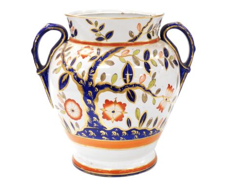 A large Victorian ironstone china two handled ovoid jar, lacking cover, painted in the Imari palette with flowering shrub dec