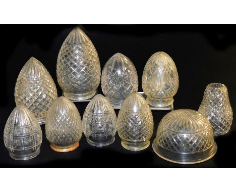 A collection of predominantly ovoid cut glass light shades, and including one of hemispherical design, in varying sizes, the 