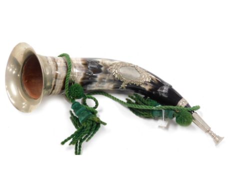 A cow horn hunting horn, with stag and oak and wreath crest, applied archer and stag and further white metal fittings with ha